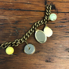 Load image into Gallery viewer, Upcycled Vintage Antique Yellow Green Button Charm Statement Bracelet
